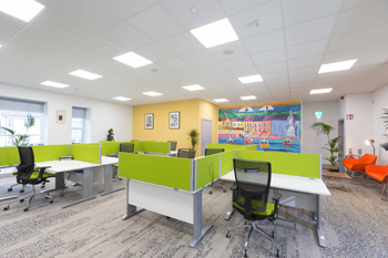 Kilrush Digital Hub hot-desks and armchairs with mural in background